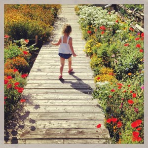 Laney on boardwalk with flowers