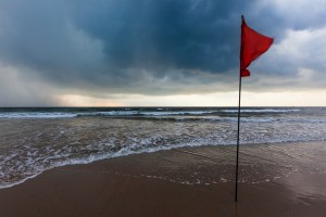 Storm warning flags on beach. Baga, Goa, India