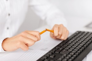 woman breaking pencil