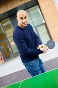 young man playing ping pong